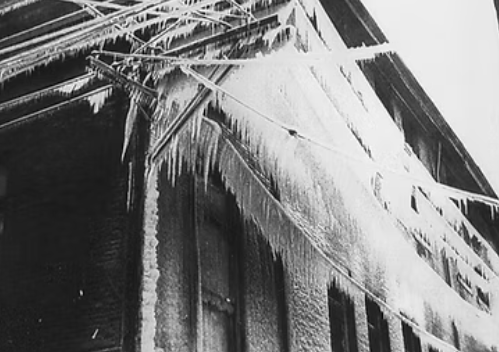 Icicles from a roof of a buildingAI-generated content may be incorrect.